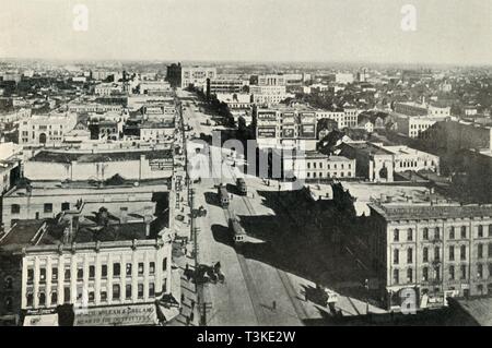 'Winnipeg To-Day; Looking Up Main Street. - The Rapid Growth of Modern Canada', c1930. Creator: Valentine & Sons Ltd.