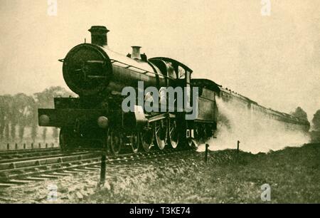 'Birmingham Express Picking Up Water at Ruislip, Great Western Railway', 1930. Creator: F. E Mackay. Stock Photo