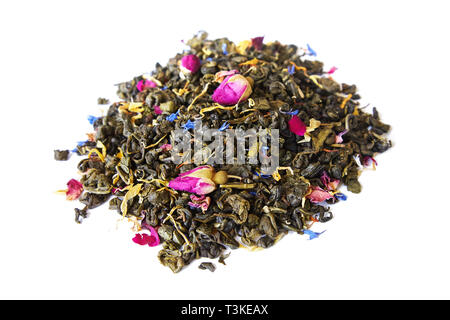 Heap of aromatic dry green tea  with cornflower and small dry buds of roses isolated on white background Stock Photo