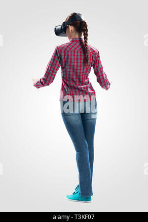 Woman wearing VR headset and gesturing in air Stock Photo
