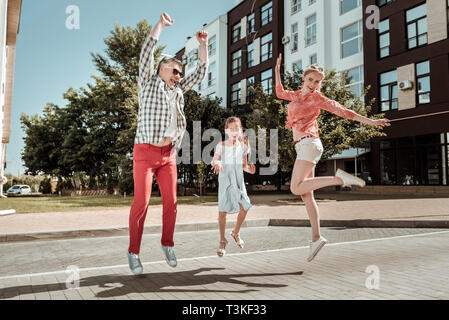 Joyful happy nice family having fun together Stock Photo