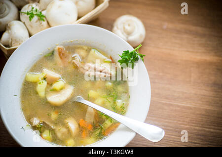 homemade rural soup with vegetables and mushrooms in a bowl Stock Photo