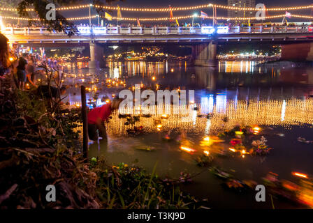 Chiang Mai, Thailand - Nov 2015: Floating lanterns with flowers on the river fro Yi Peng (Yee peng) festival in Chiang Mai, motion image Stock Photo