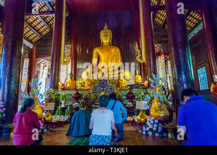 Chiang Mai, Thailand - Nov 2015: People praying in the temple before Loi Krathong festival. Stock Photo