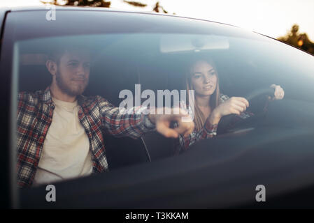 Male instructor and woman student, driving lesson Stock Photo