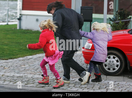 Family out in storm 'Per'. Stock Photo