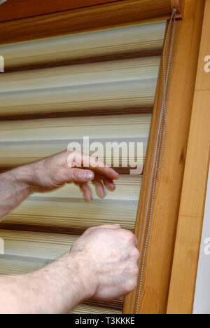 Window blinds installation Stock Photo