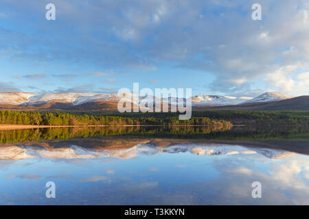 Loch Morlich and Cairngorm Mountains, Cairngorms National Park near Aviemore, Badenoch and Strathspey, Scotland, UK Stock Photo