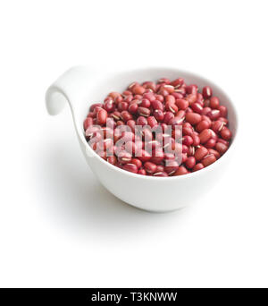 Red adzuki beans in bowl isolated on white background. Stock Photo