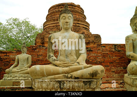 Beautiful Buddha Images in Front of the Stupa Ruins of Wat Yai Chai Mongkhon Temple, Ayutthaya Archaeological site, Thailand Stock Photo