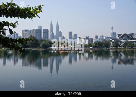 Petronas Twin Towers, KL Tower, and Istana Budaya (opera house) viewed from Titiwangsa Lake Gardens, Kuala Lumpur, Malaysia Stock Photo