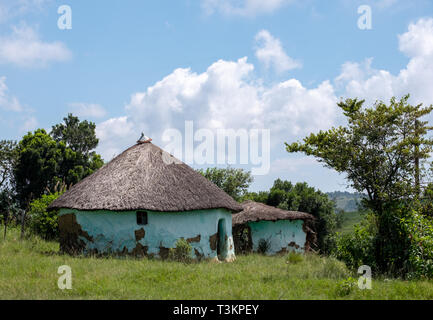 Colourful painted Zulu mud hut / rondavel / kraal in rural Kwazulu Natal, Wild Coast, South Africa Stock Photo