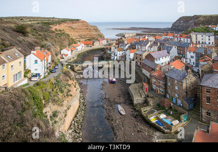 A classic view of Staithes at low tide, Staithes is a a traditional fishing village and seaside resort on the North Yorkshire coast, England UK.