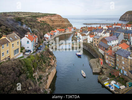A classic view of Staithes at high tide. Staithes is a a traditional fishing village and seaside resort on the North Yorkshire coast, England UK.
