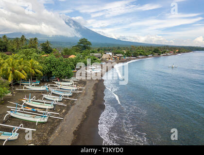  Mount  Agung  on Bali and fishing boats silhouetted against 