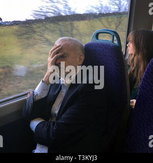 Labour Party leader Jeremy Corbyn, pictured on a train from Stirling to Edinburgh after attending the 2017 Scottish Labour Party Conference in Perth. The Leader of the Opposition gave a speech on the last day of the annual conference. Labour lost the Copeland by-election this week to the Conservative Party.  Photograph © Colin McPherson, all rights reserved.  Contact copyright holder prior to publication.  E: colinmcpherson@mac.com T: 07831 838717 Stock Photo