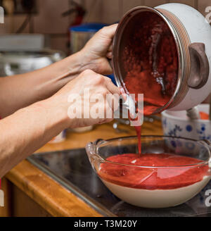 Female hands prepare a dessert Stock Photo