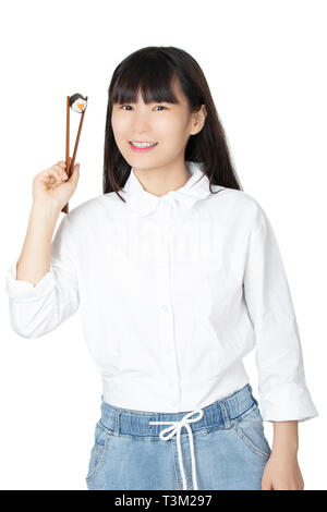 Beautiful Chinese American woman holding sushi with chopsticks isolated on white background Stock Photo