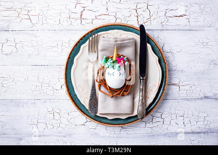 Easter table setting with quail eggs Stock Photo