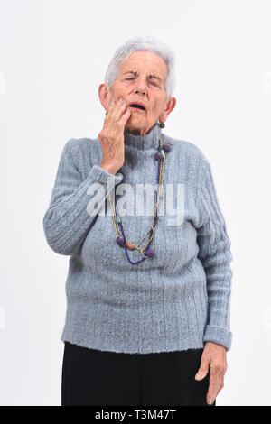 Senior woman with toothache on white background Stock Photo