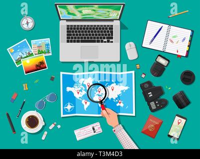 Laptop pc and paper map. Photo camera and photos, notepad with pencil, compass, marker, coffee cup, eyeglasses, smarrphone. Traveler planning trip. Ve Stock Vector