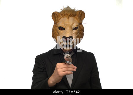 suit in a lion mask Stock Photo