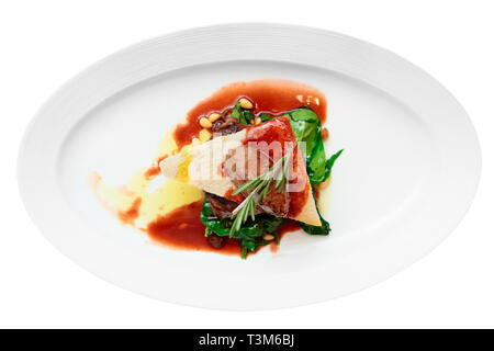 Tenderloin steak with beef terrine and spinach isolated on white Stock Photo