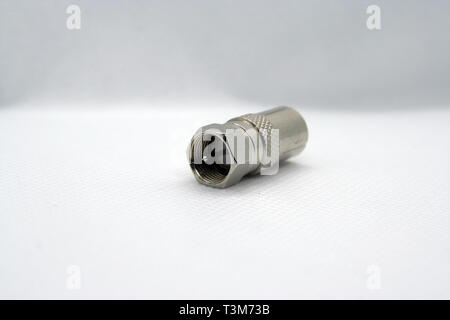 Coaxial cable jack. Antenna cable jack. Coaxial cable extension jack. Metal made cable jack. Stock Photo