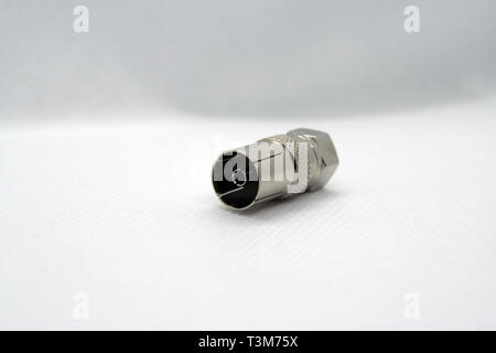 Coaxial cable jack. Antenna cable jack. Coaxial cable extension jack. Metal made cable jack. Stock Photo