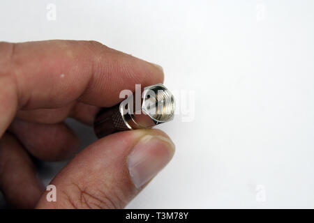 Coaxial cable jack. Antenna cable jack. Coaxial cable extension jack. Metal made cable jack. Stock Photo