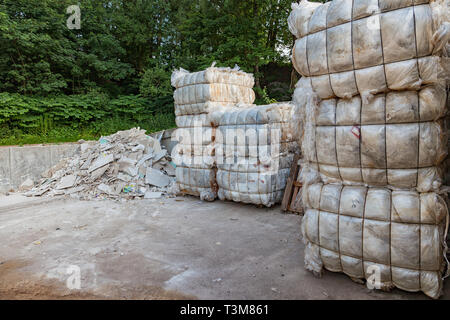 Bundle / cube with plastic garbage on a recycling yard Stock Photo