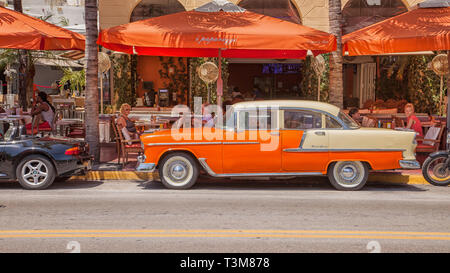Miami, United State - April 7, 2014: A Chevrolet Bel Air in front of a bar on Oceans Drive in South Beach. Stock Photo