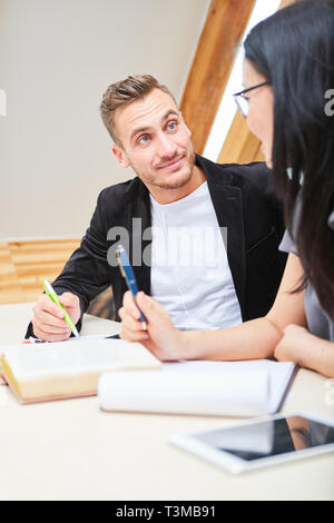 Student couple is learning together in seminar or preparing for an exam Stock Photo