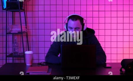 Gamer in headphones streaming the game. Stock Photo