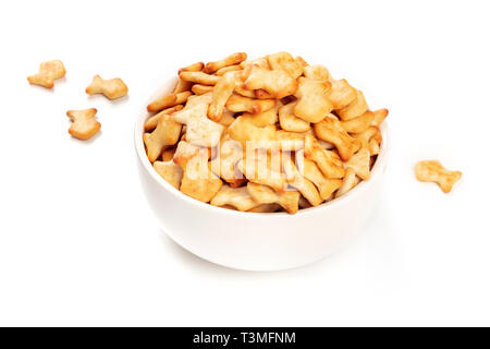 Salty goldfish crackers in a bowl on a white background with a place for text Stock Photo