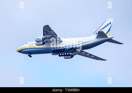 An Antonov Design Bureau UR - 82008 airlines cargo plane comes into land as it approaches Blackpool airfield, UK Stock Photo