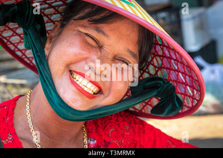 Middle aged Vietnamese woman wearing a traditional sampan hat, Hoi An, Quang Nam Provence, Vietnam, Asia Stock Photo