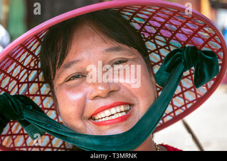 Middle aged Vietnamese woman wearing a traditional sampan hat, Hoi An, Quang Nam Provence, Vietnam, Asia Stock Photo