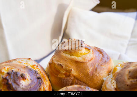 Hot sweet rolls in the shape of snails baked in a homemade bakery, closeup, concept of small business, bakeries, mini-hotel Stock Photo