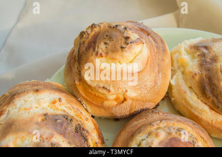 Hot sweet rolls in the shape of snails baked in a homemade bakery, closeup, concept of small business, bakeries, mini-hotel Stock Photo