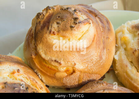 Hot sweet rolls in the shape of snails baked in a homemade bakery, closeup, concept of small business, bakeries, mini-hotel Stock Photo