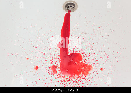 Splashes of blood dripping into the sink in the bathroom Stock Photo