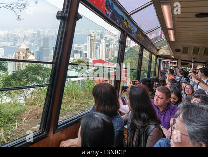 Passengers on the Peak Tram, Victoria Peak, Hong Kong Island, Hong Kong, China Stock Photo