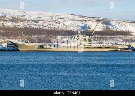 MURMANSK, RUSSIA - FEBRUARY 21, 2019: The heavy aircraft carrier 'Admiral Kuznetsov' parked in the Kola Bay Stock Photo