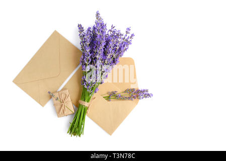 Fresh lavender flowers and envelopes on white background Stock Photo