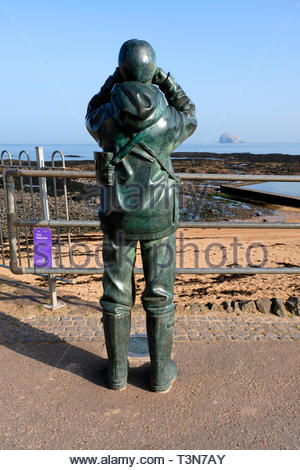 'The Watcher', sculpture with a view towards the Bass Rock outside the Scottish Seabird Centre, North Berwick, Scotland Stock Photo