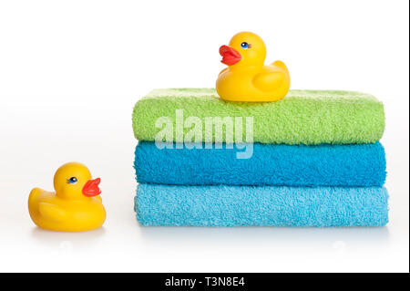 rubber ducks on towels stack Stock Photo