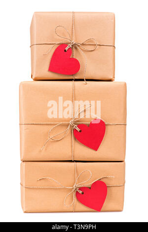 Stacked gift boxes with blank heart-shaped labels isolated on white Stock Photo