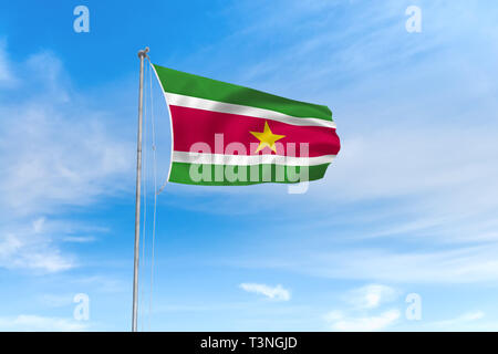 Suriname flag blowing in the wind over nice blue sky background Stock Photo