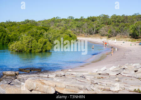 People fishing and swimming in mangrove lined bay, Cape Leveque, Dampier Peninsula, Western Australia Stock Photo